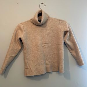 Small beige wool sweater